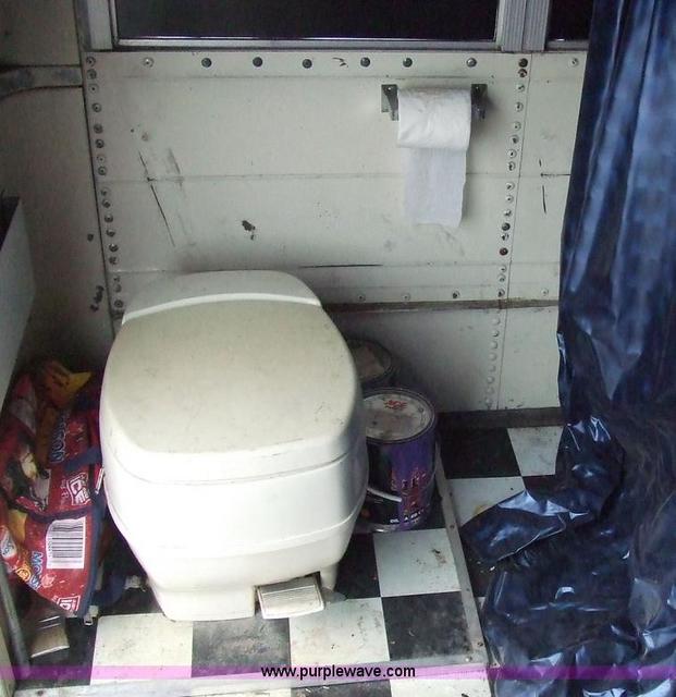 Semi-private toilet on converted schoolbus