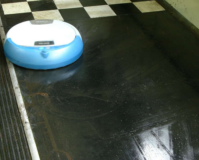 Scooba floor cleaner in aft port area of schoolbus