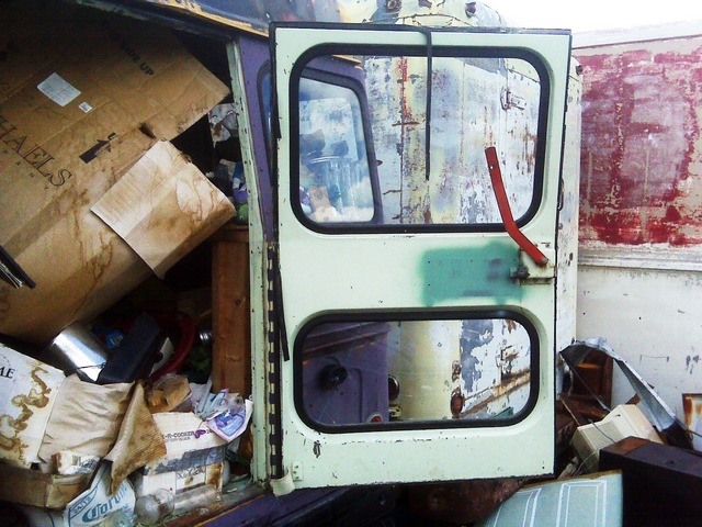 Rear door of junkyard Bluebird bus, open
