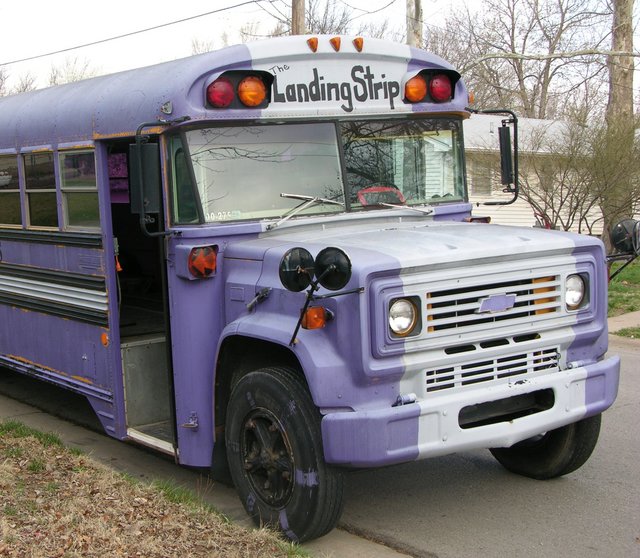 Schoolbus with former owner's logo