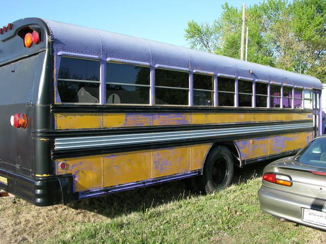 Schoolbus with some purple paint removed