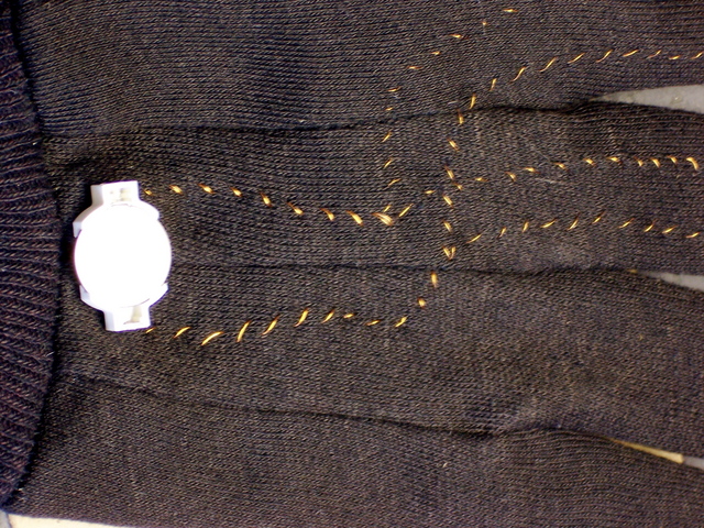 Back of glove with battery holder attached