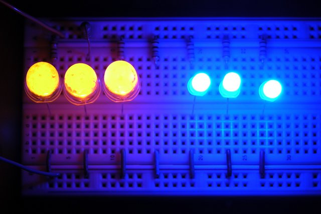 10mm yellow and 5mm blue LEDs on breadboard, lit