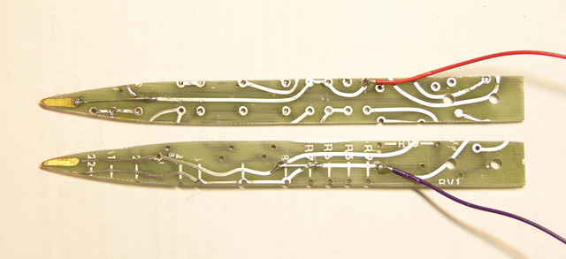 Two halves of SMT probe tweezers, wired