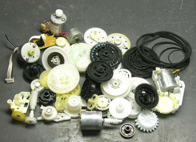 Pile of VCR gears, pulleys, belts, and motors