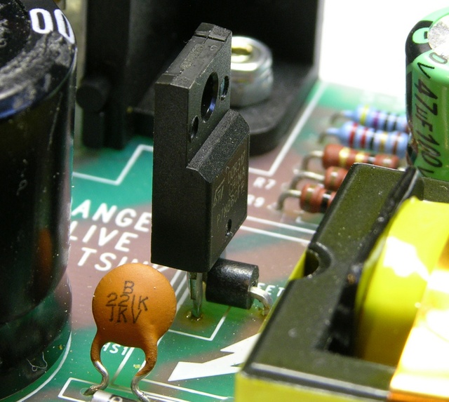 Power supply switching FET with ferrite bead