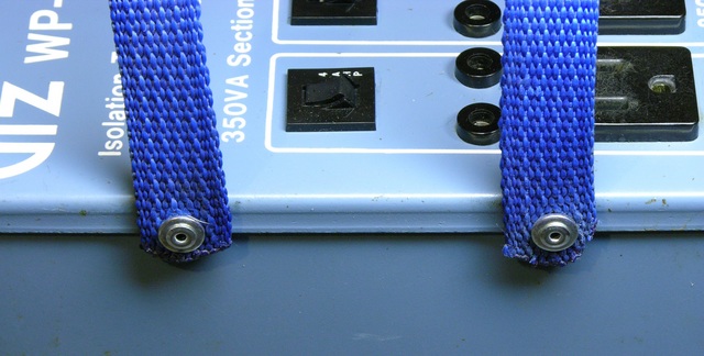 Closeup of rivets in fabric carrying handles