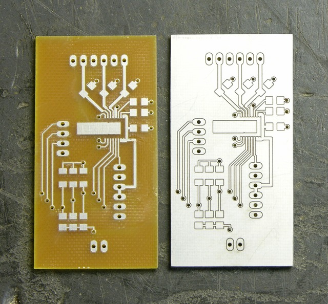 Two milled circuit boards, one peeled