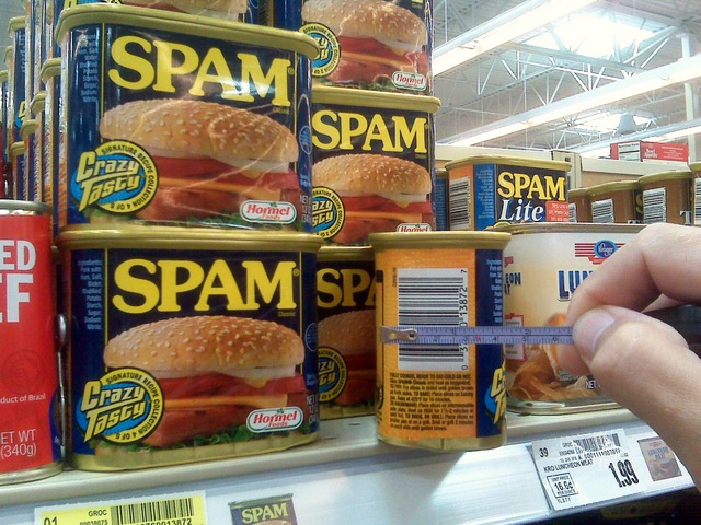 Measuring width of Spam can at grocery store