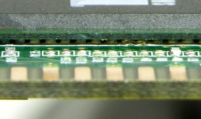 Corrosion under BGA IC, closeup