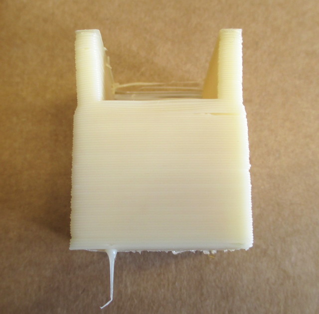 Filament-wiping sponge holder, warp