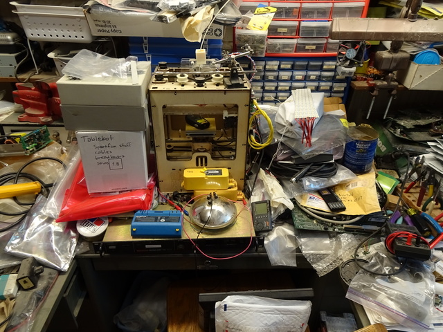 messy workbench with MakerBot CupCake