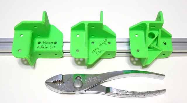 three 3D-printed corner brackets for 2020 aluminum extrusion