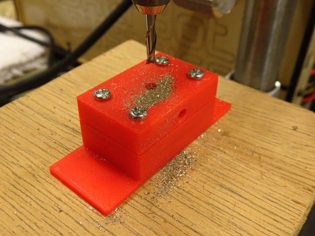 Dremel drill press with milling bit and workpiece
